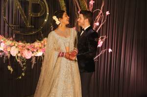 Priyanka Chopra and Nick Jonas pose for photos during their wedding reception, at Taj Palace.