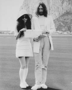 John Lennon and Yoko Ono, hold the marriage certificate following their registry office wedding here on March 21st.